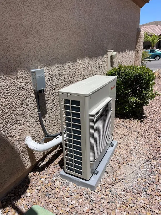 Residential air conditioning condenser unit in Bethel